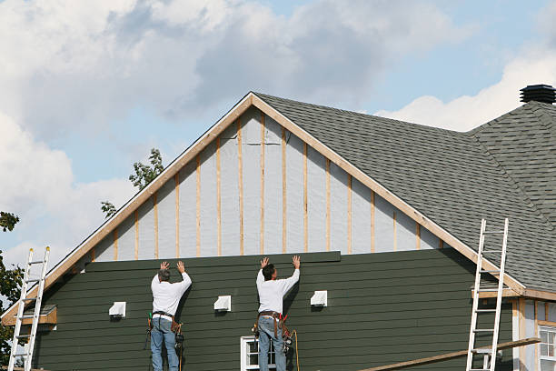 Professional Siding Replacement technician working in Evans, CO